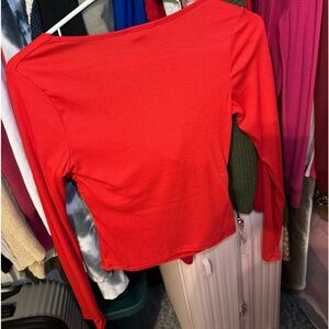 Medium red long sleeve shirt. Very comfortable, runs a bit small. Wore once!